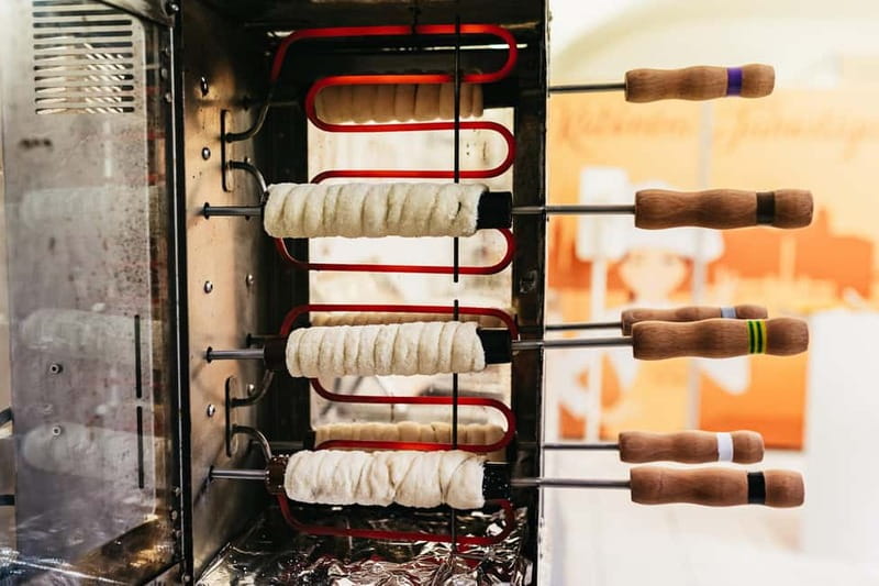 Budapest: Hungarian Chimney Cake Workshop in the City Center - Rolling, wrapping, and baking for the shiny caramel crust