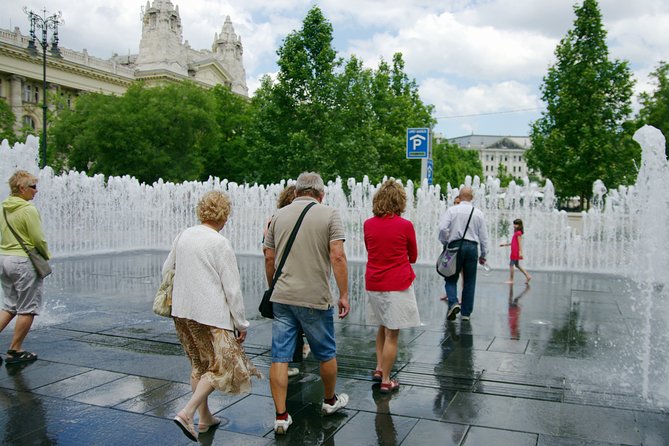 Classic Walk in Budapest Historical Center - Elizabeth Square: a park crossing, Danube Fountain, and the ferris wheel area